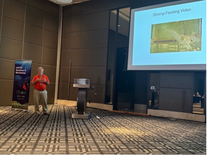 Dr. Allen Davis giving a presentation on the importance of shrimp feed signaling