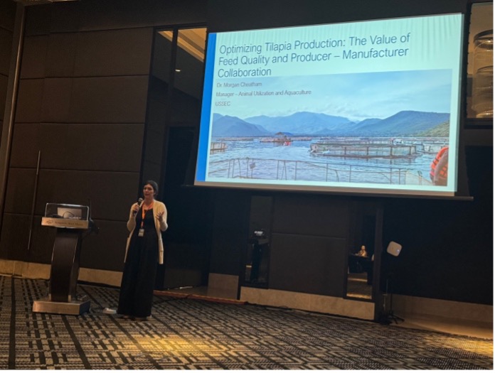 Dr. Morgan Cheatam giving a presentation about the value of feed quality and aquaculture production